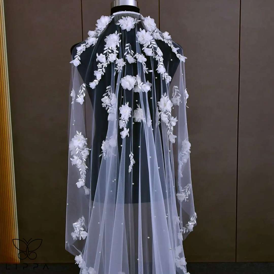 Pearl beaded wedding veil with floral accents for brides.