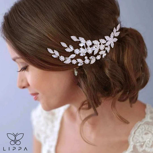 Elegant bridal hair comb with rhinestone-encrusted leaf and floral design, perfect for weddings and formal events. Lightweight, secure, and timelessly stylish