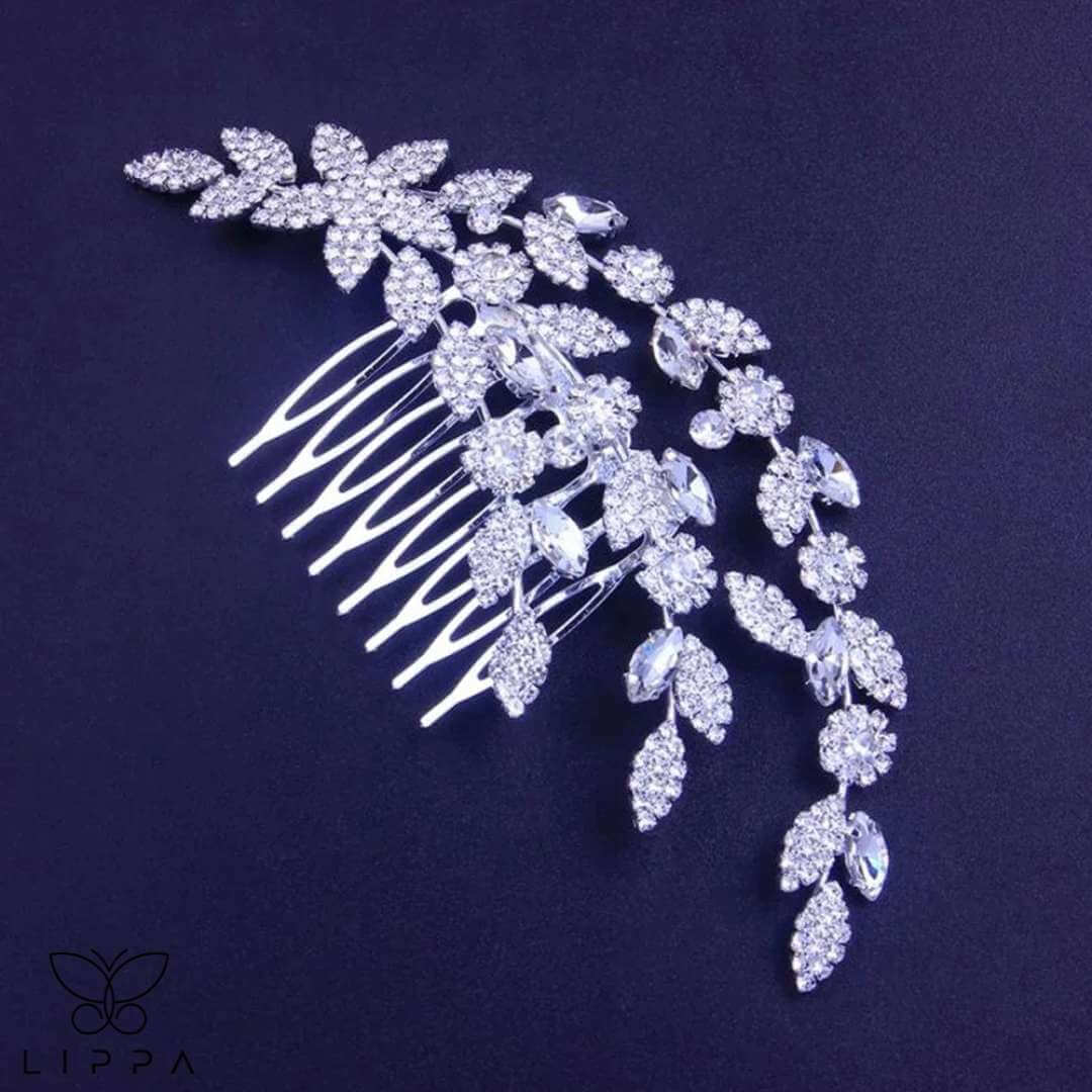 Elegant bridal hair comb with rhinestone-encrusted leaf and floral design, perfect for weddings and formal events. Lightweight, secure, and timelessly stylish